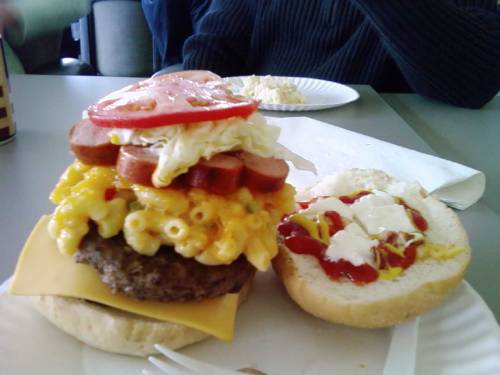 The Potluck Burger A burger with sliced hot dogs, potato salad, mac and cheese, tomato, ketchup, mustard and mayonnaise. (submitted by Jeeves)